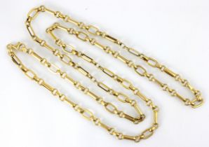 A yellow metal necklace, the oval links with circular link detail, stamped to lobster fastener '375'