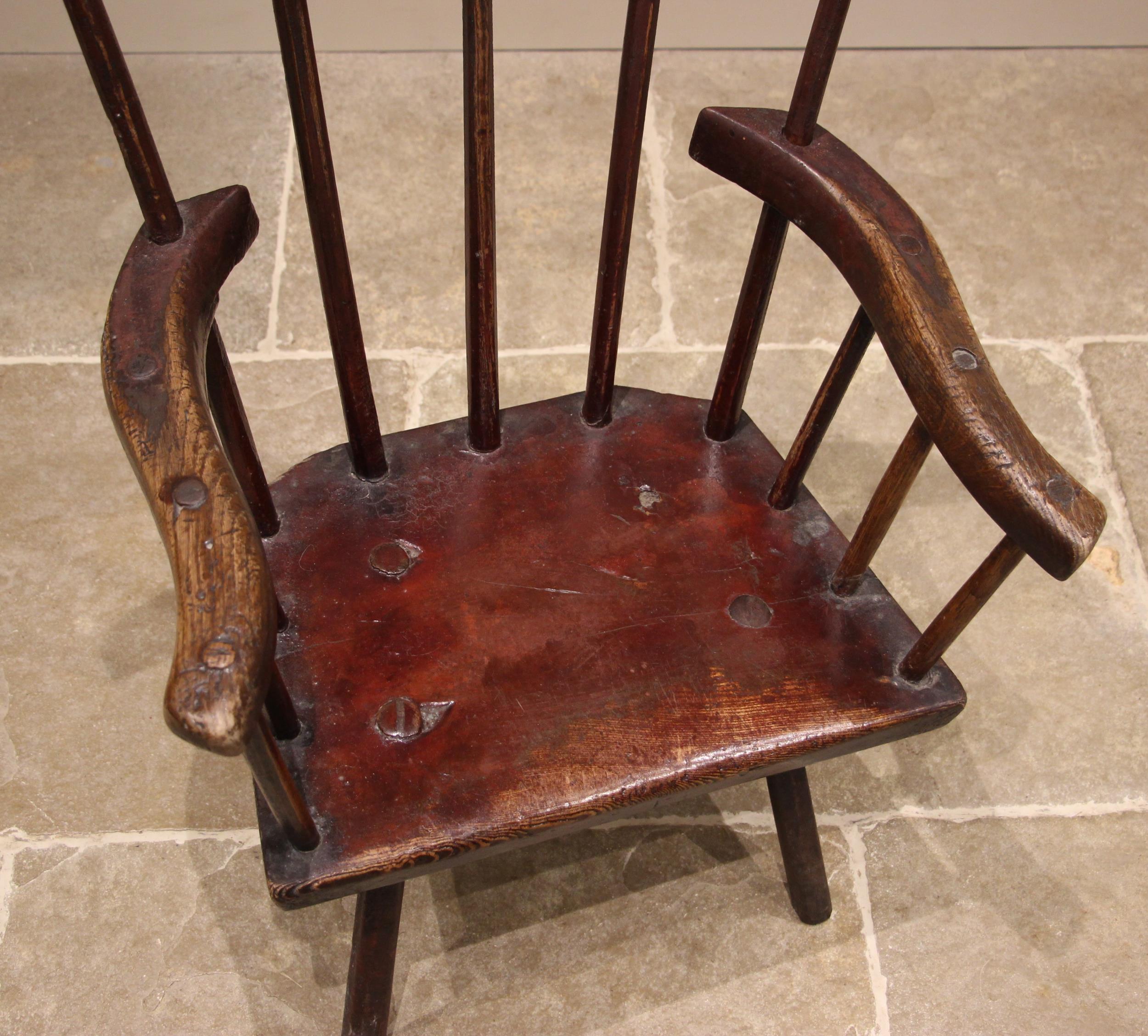 A primitive stained ash comb back chair, probably West Country, late 18th/early 19th century, the - Image 2 of 8