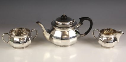 A George V silver tea service, Walker and Hall, Sheffield 1930, comprising a teapot, sugar bowl