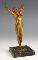 Percimer Rudolfi (German, 1884-1932), 'Awakening', an Art Deco gilt bronze study of a female nude,