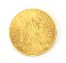 A 100 Corona Austian gold coloured coin, dated 1915, 33gms (restrike)