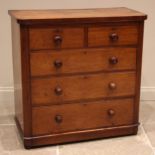 A Victorian mahogany chest of drawers, the rectangular top with rounded front corners over an