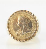 A Victorian half sovereign style ring, the coin mounted within a gold coloured plain polished shank,