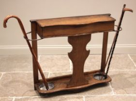 A Victorian golden oak hall stand, the hinged serpentine glove compartment flanked by brass railed