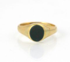 An 18ct yellow gold signet ring, the oval bloodstone leading to a plain polished shank, stamped ‘L&