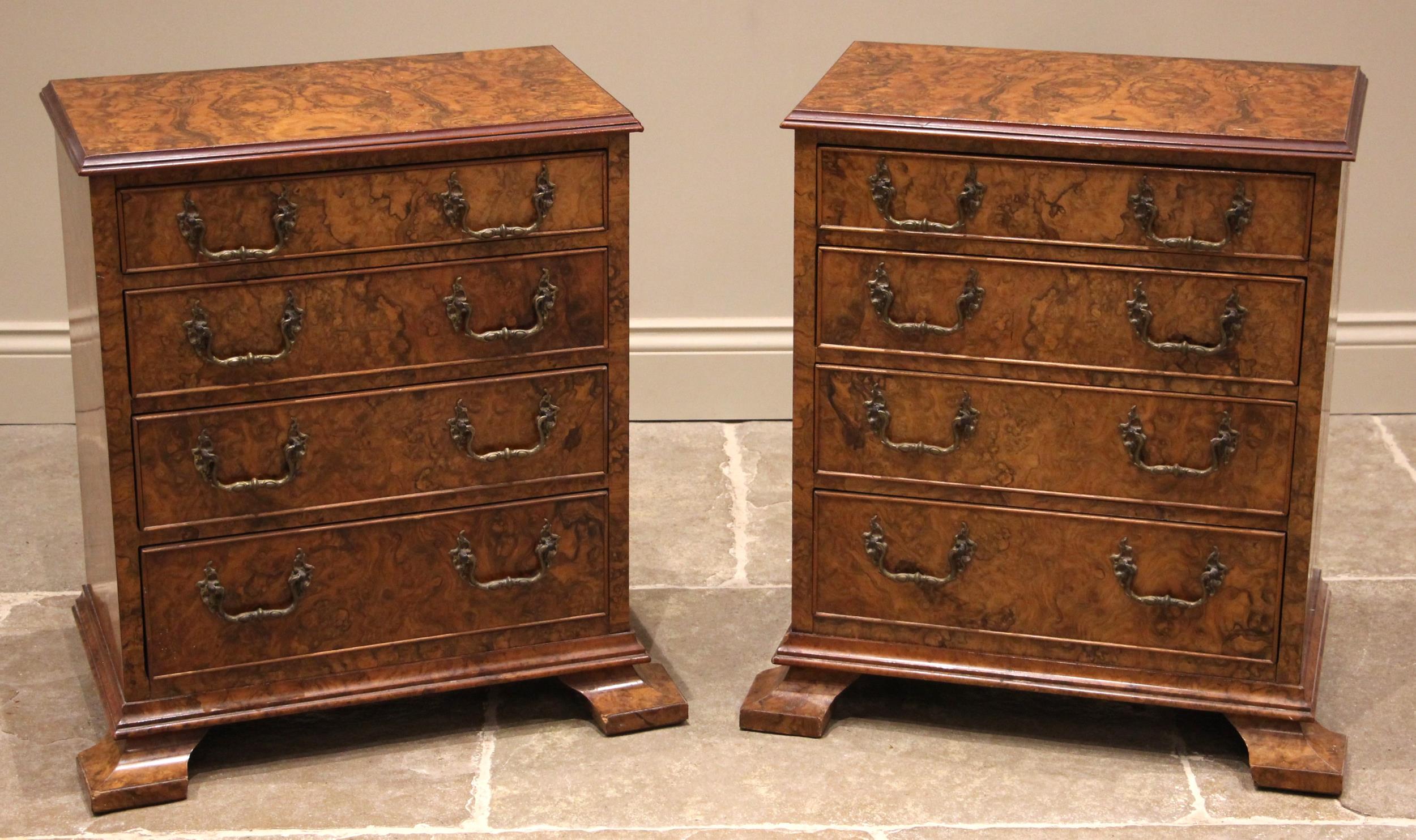 A pair of figured walnut chests, early 20th century and later constructed, each formed with four