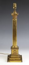 A Victorian lacquered brass Corinthian column table lamp by Hinks, raised on a stepped square plinth