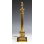 A Victorian lacquered brass Corinthian column table lamp by Hinks, raised on a stepped square plinth