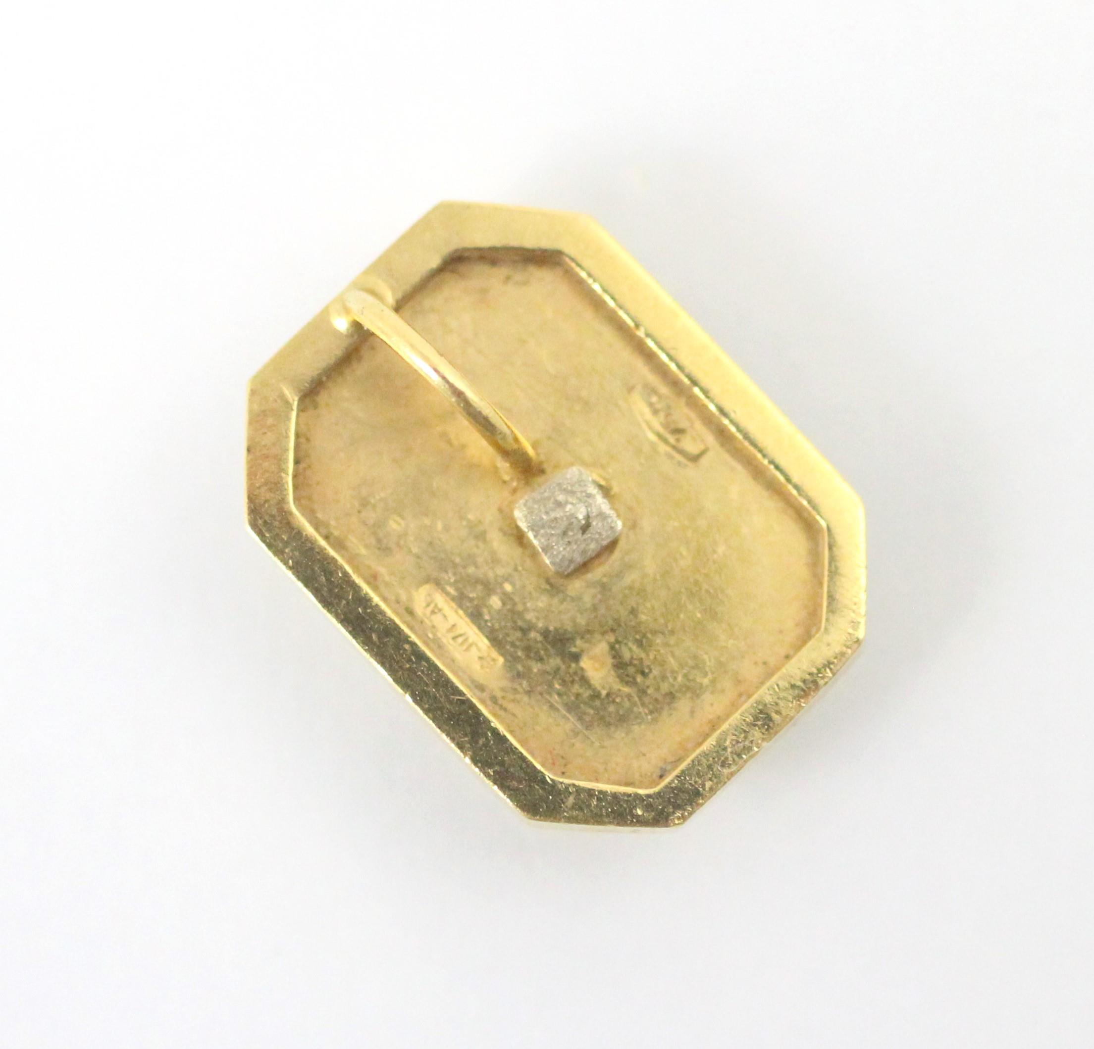 A yellow metal and diamond pendant, the mixed cut diamonds within white metal ‘H’ setting, upon a - Image 2 of 2