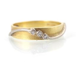An 18ct yellow gold and diamond ring, the yellow gold matte detailed ring with applied white metal
