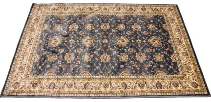 A Kashmir rug, all over floral design, upon a sky blue ground, within a trailing ivory border, 170cm