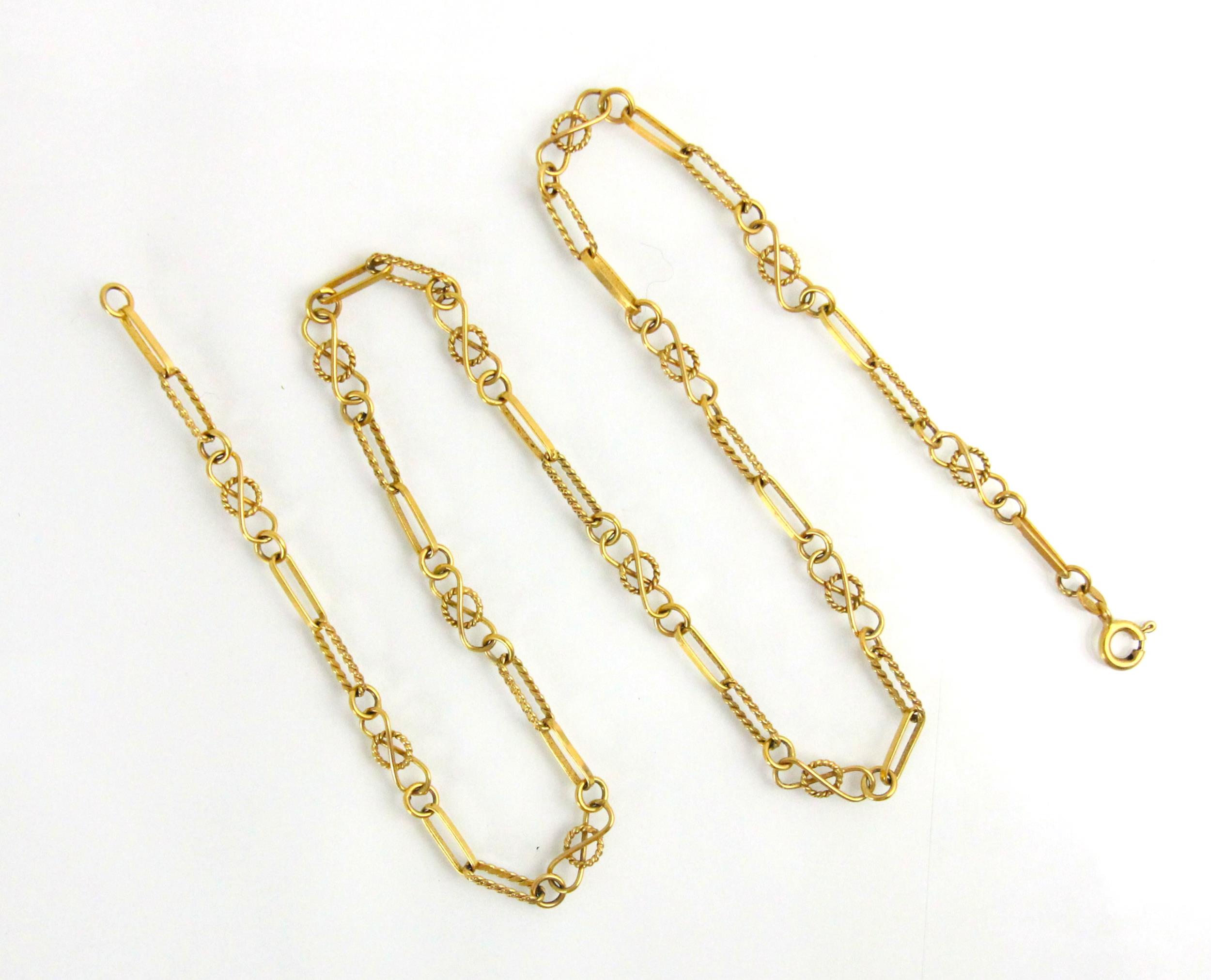 A 9ct yellow gold fancy link chain, the rope twist links with circular infinity style links, bolt