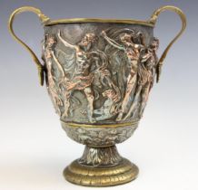 A 19th century repousse cup, possibly by Elkington & Co, decorated with a continuous frieze of