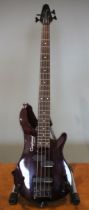 A Rebel 4K Tanglewood bass guitar, stained natural wood finish, within fabric case