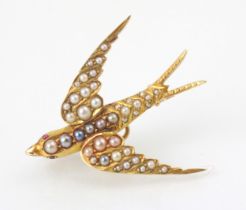 An early 20th century yellow metal and seed pearl set dove brooch, the dove set with graduated