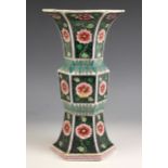 A Chinese porcelain famille noir Gu vase, 19th century, of flared hexagonal form with ogee shaped