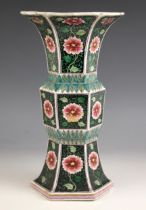 A Chinese porcelain famille noir Gu vase, 19th century, of flared hexagonal form with ogee shaped