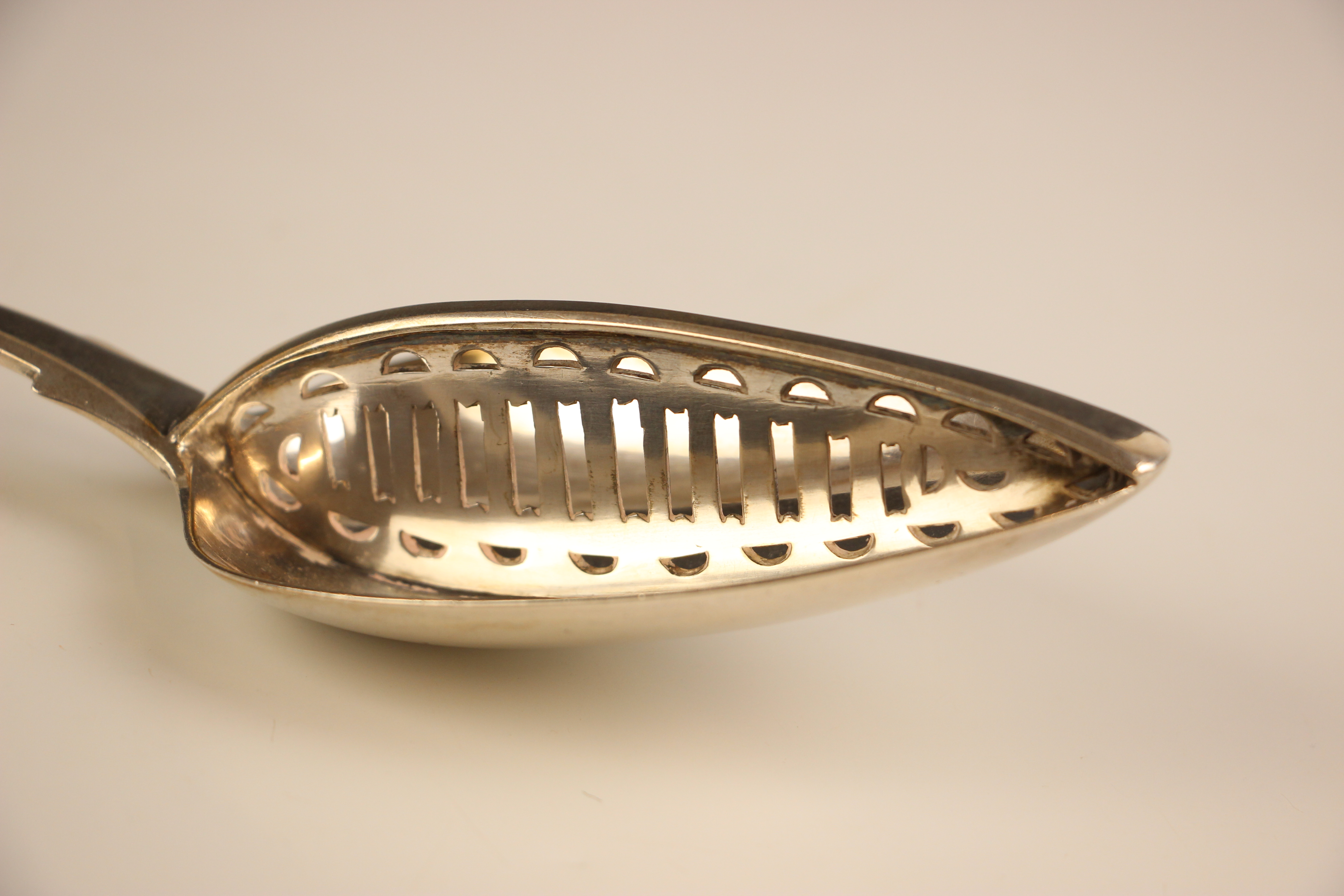 An Irish silver fiddle pattern straining spoon, Richard Sawyer, Dublin 1837, the bowl of the spoon - Image 4 of 5