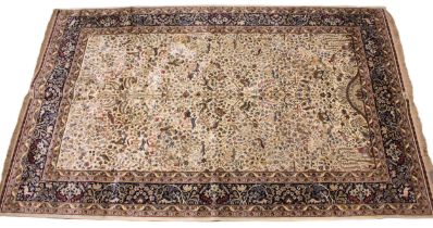 An ivory ground Kashmir rug, the all over tree of life design punctuated with zoomorphic and foliate