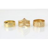 An 18ct yellow gold wedding band, stamped to interior ‘WTT&Co’ Birmingham 1968, ring size N, with