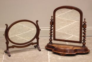 A Victorian mahogany dressing table mirror, the arched mirrored plate upon barley twist supports and