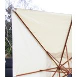 A large garden/patio parasol, by Skagerak, Denmark, folding white fabric cover upon a hardwood