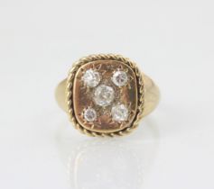 A 9ct yellow gold diamond dress ring, the five graduated old cut diamonds in square head with rope