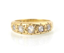 A 19th century 18ct yellow gold and diamond gypsy ring, the five old cut diamonds in engraved star