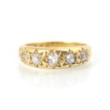 A 19th century 18ct yellow gold and diamond gypsy ring, the five old cut diamonds in engraved star