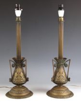 A pair of brass table lamp bases, 20th century, each with fluted column stem set to a conical body
