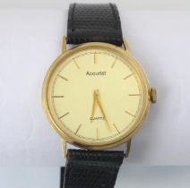 A yellow metal cased Accurist quartz wristwatch, the circular dial with baton markers, set to a