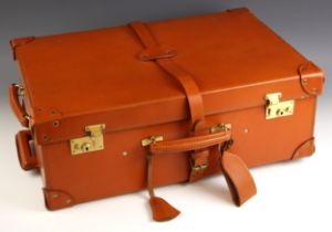 A leather Swaine & Adeney wheeled suitcase, with extending handle, reinforced corners and buckled