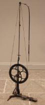 A Victorian dentist's treadle drill, the cast iron pulley wheel with a Japanned treadle (worn),