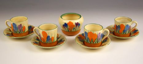 A Clarice Cliff Bizarre range part coffee service in the 'Crocus' pattern, comprising: four coffee