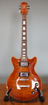 A Gonzo custom made electric guitar, made in Warrington, England, satin wood finish, within fitted