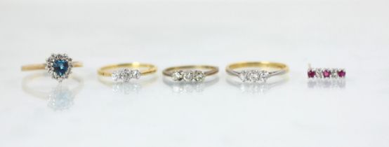 A selection of jewellery, including an early 20th century diamond three stone ring, the central