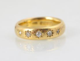 A 22ct yellow gold diamond set ring, the five graduated old cut diamonds later set into a 22ct