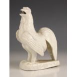 A Chinese porcelain Blanc De Chine model of a cockerel, circa 1700, 17cm high (at fault)