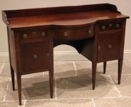 A 19th century mahogany sideboard, possibly Irish, the galleried top of break arch form outlined