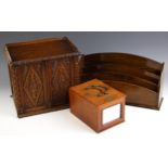 A Victorian carved oak stationery cabinet, the two doors opening to a compartmented interior with