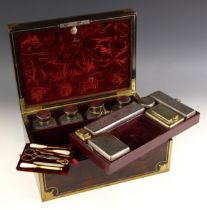 An early 19th century brass bound coromandel vanity case, circa 1840, the hinged cover with