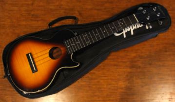 An Epiphone ukelele Les Paul model, serial 13081307352, within fabric case