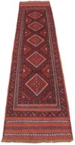 A full pile hand woven Afghan Mashwani tribal runner, in red and blue colourways, the five lozenge