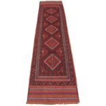 A full pile hand woven Afghan Mashwani tribal runner, in red and blue colourways, the five lozenge