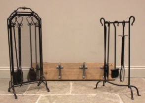 A contemporary blacksmith-made wrought iron fireside companion set, the frame supporting a poker,