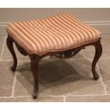 A French walnut dressing stool, late 19th century, the rectangular upholstered seat over a