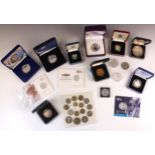 A collection of British commemorative coins, including silver proof £2 coin, £20 silver coins,