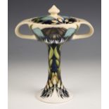 A Moorcroft bonbonierre in the 'Indigo Lace' pattern designed by Vicky Lovatt, of twin handled