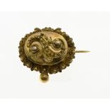 Small gold regional brooch