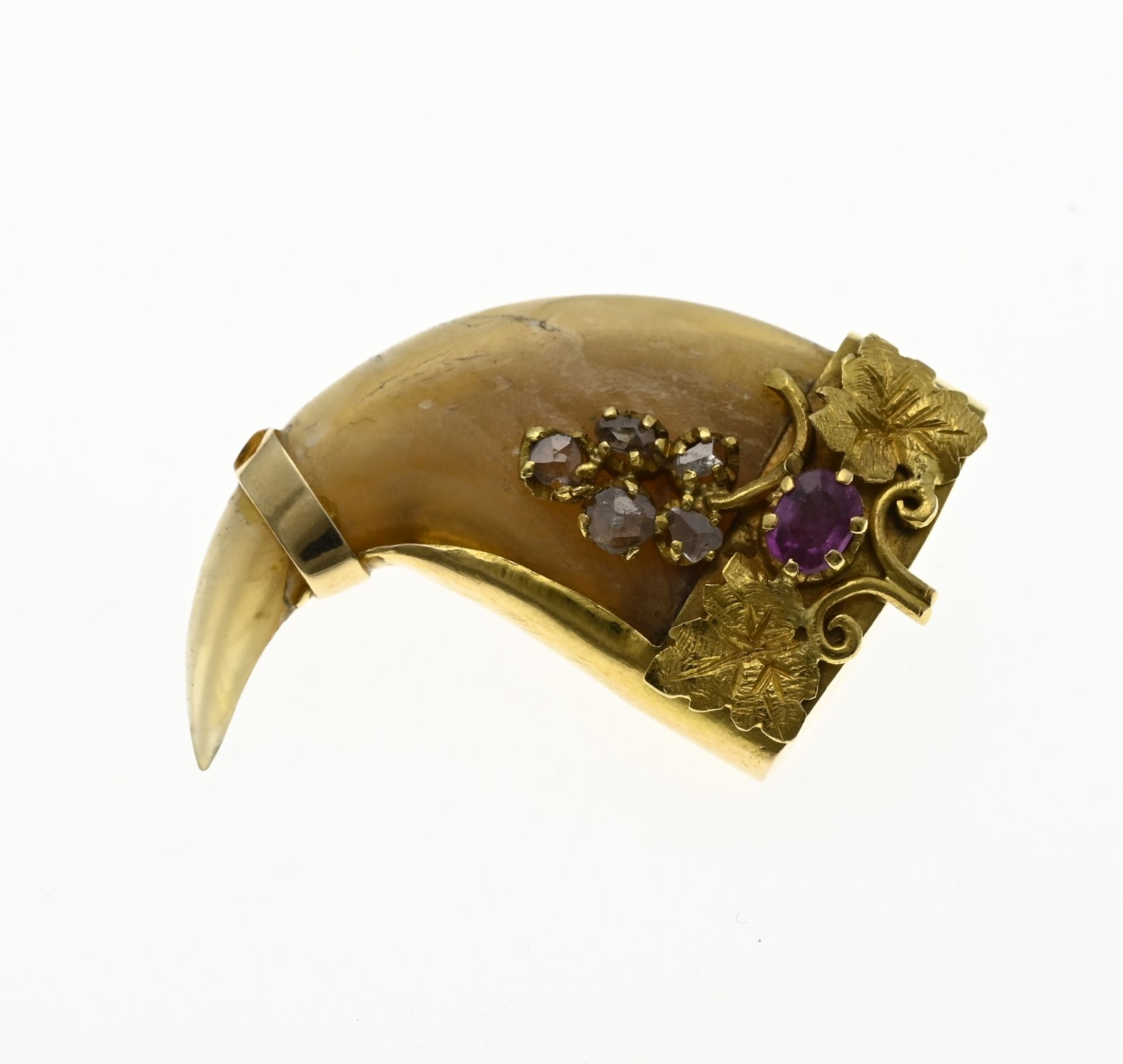 Gold brooch with tooth and stones